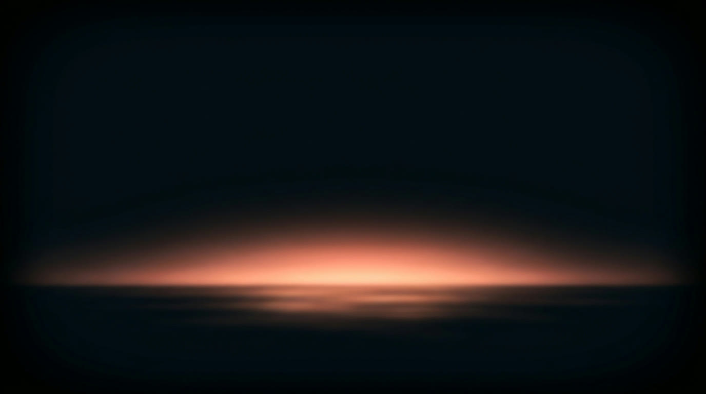 Warm coral light rising softly out of darkness, like dawn breaking over calm black water.